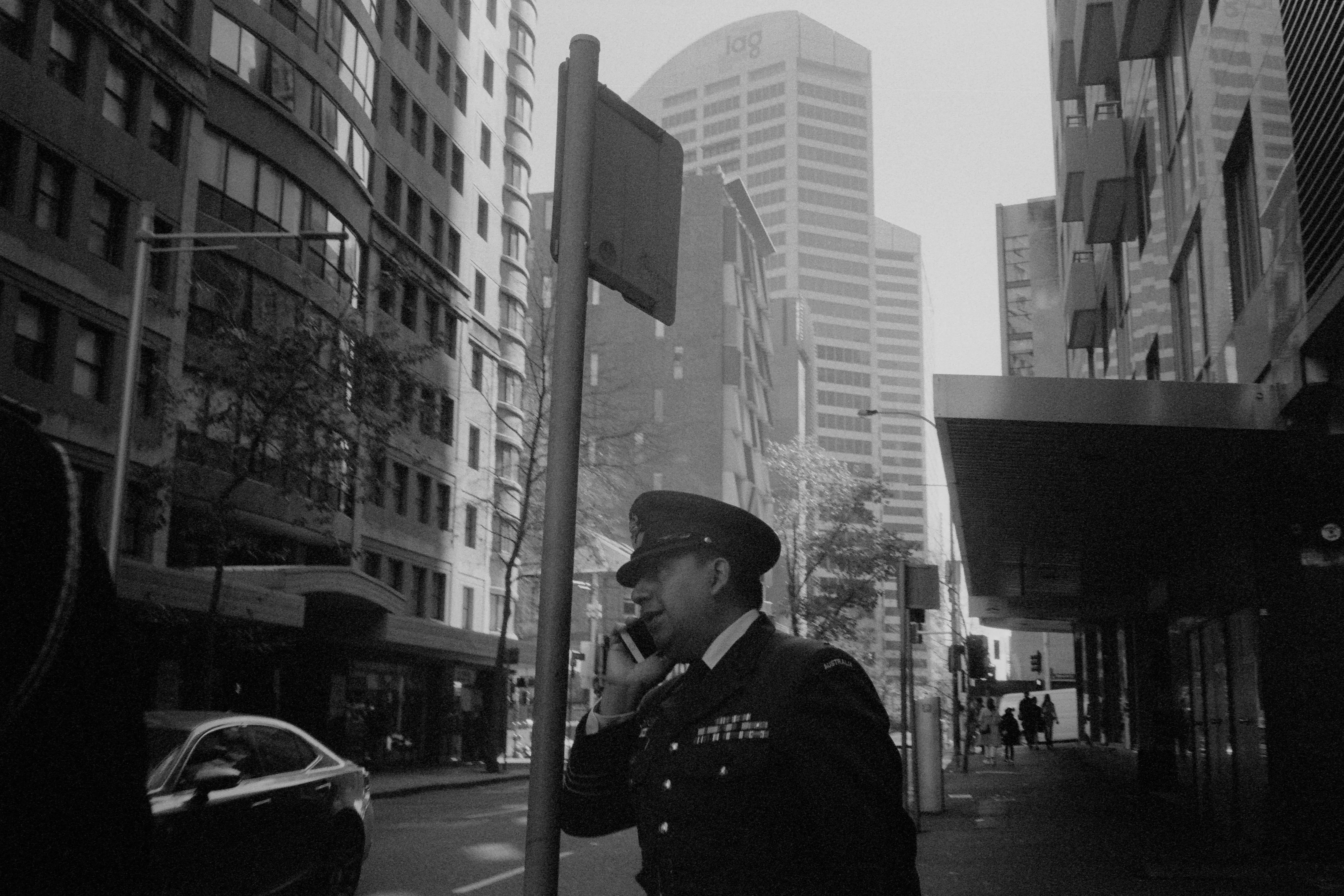 officer taking a call in the street